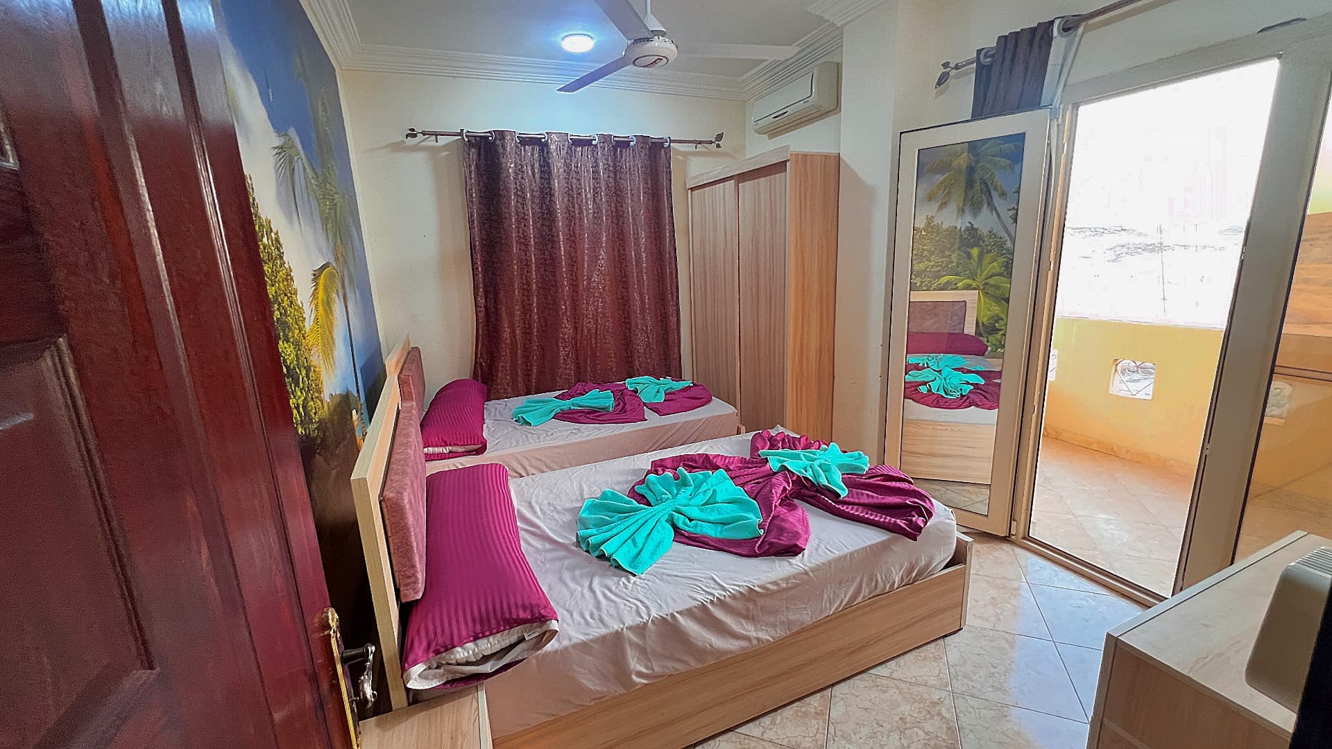 Second bedroom with two beds and air conditioning