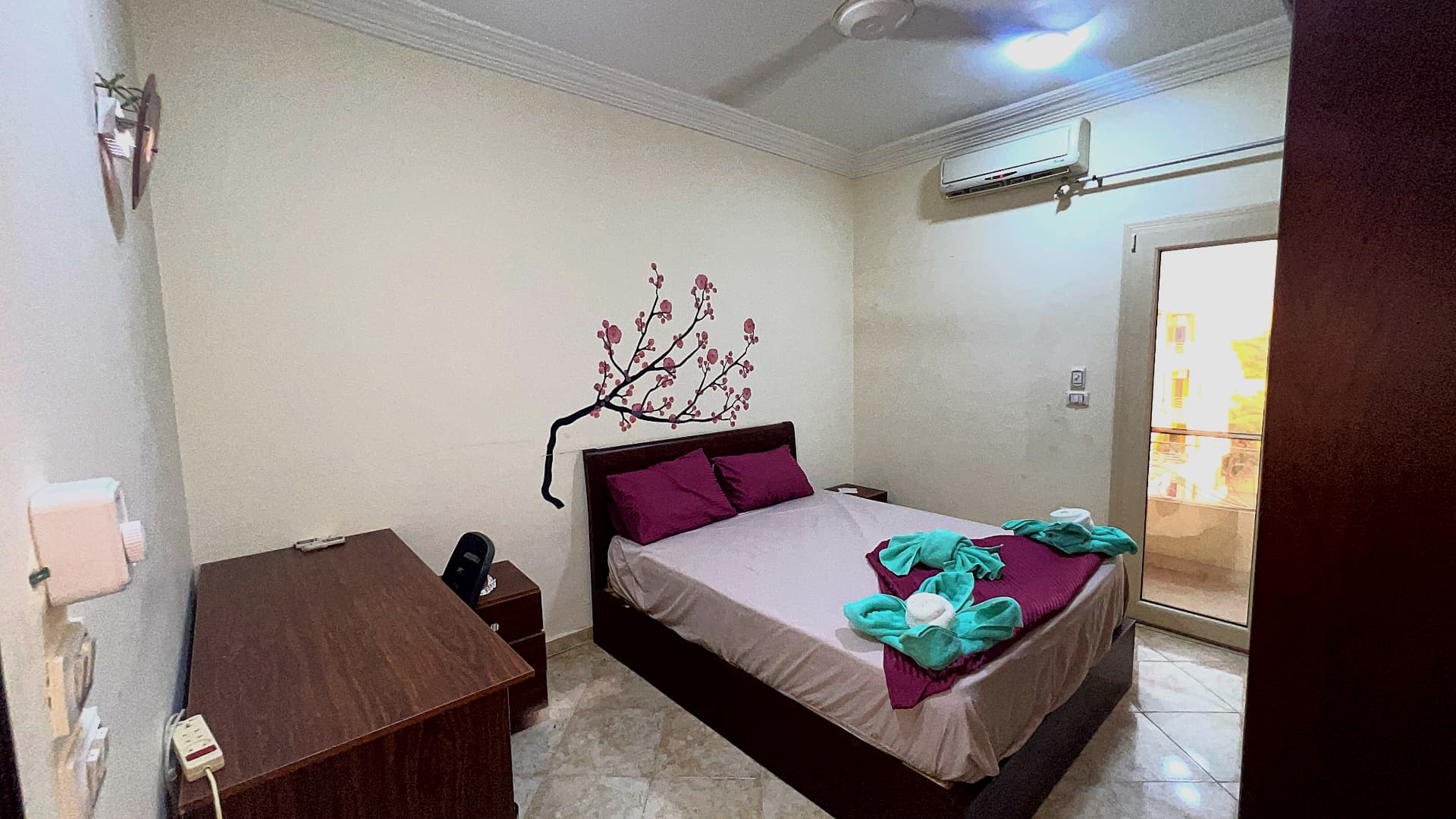 Master bedroom with large bed and storage