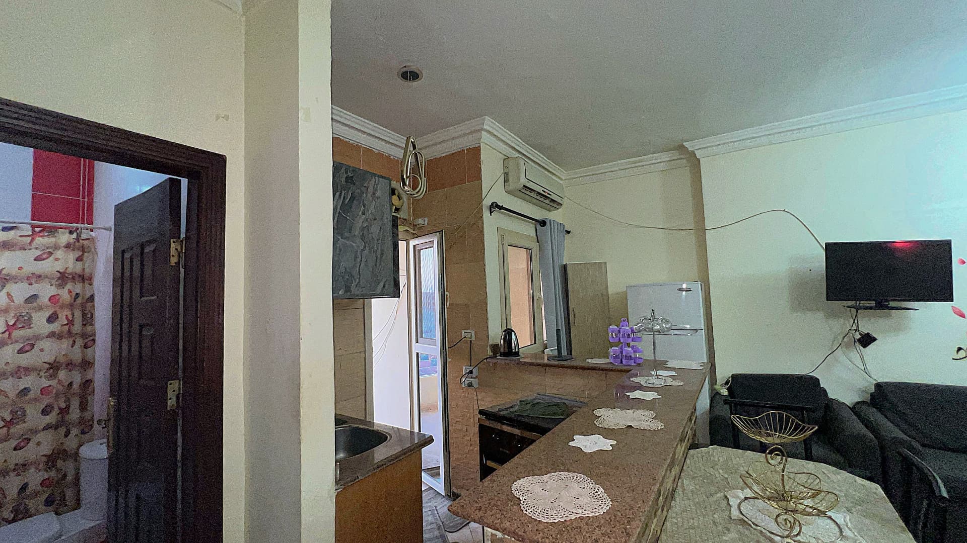 Fully equipped kitchen with stove and sink